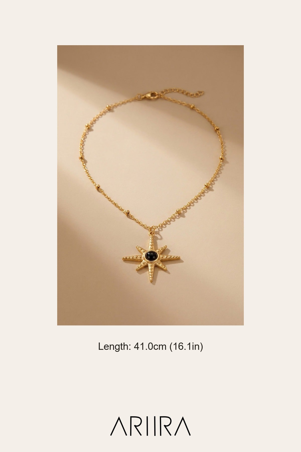 gold Gaia Gold Tone Starburst Pendant Necklace