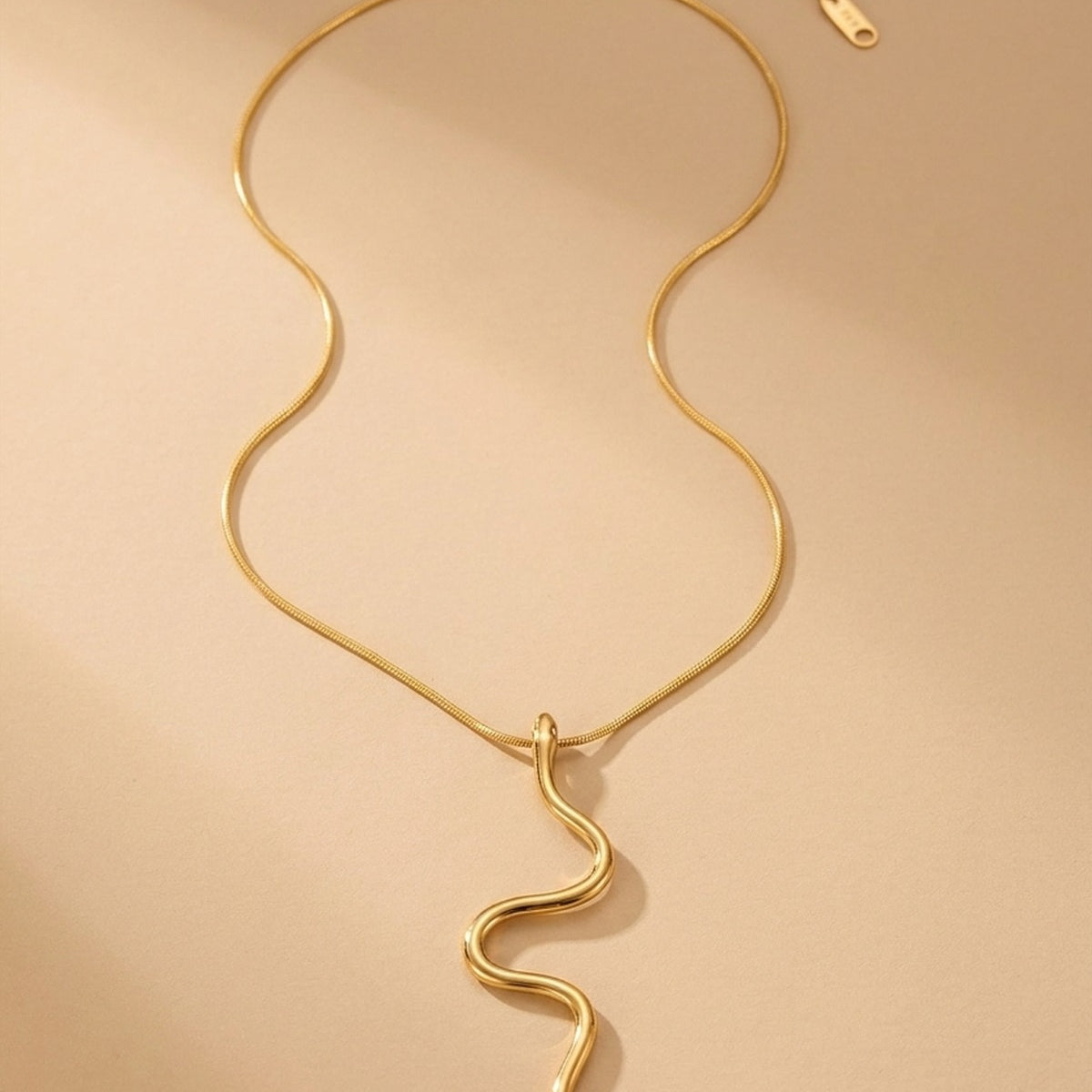 gold India Gold Tone Wavy Serpent Pendant
