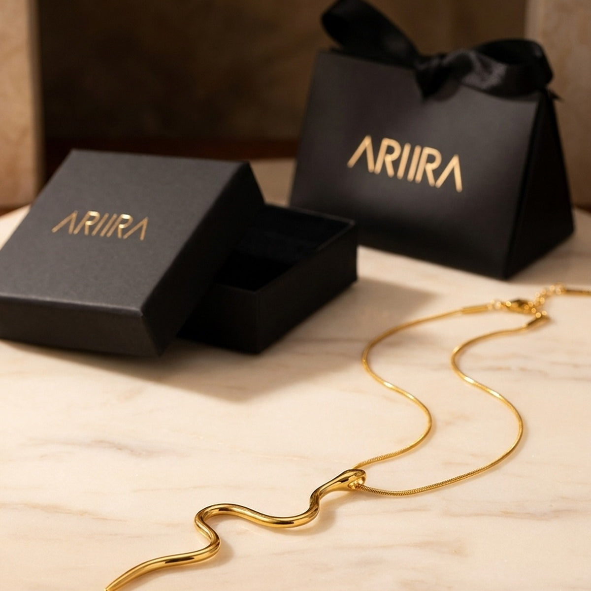 gold India Gold Tone Wavy Serpent Pendant