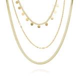 Isla Triple Layered Gold Necklace featuring textured chains and coin drops, crafted from tarnish-resistant gold-plated stainless steel.