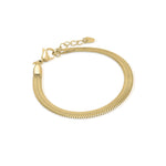 Rhea Sleek Herringbone Bracelet by ARIIRA, showcasing a smooth, reflective gold finish and elegant design for everyday style.