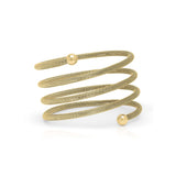 Elegant ARIIRA Zina Spiral Mesh Coil Bracelet in gold, showcasing a textured design with polished end spheres.