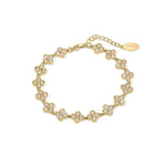 ARIIRA delicate crystal flower link bracelet in gold, capturing light with petite sparkles, perfect for elegance and femininity.