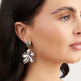 Silver Malia Bloom Statement Earrings by ARIIRA, showcasing delicate floral design and textured petals.