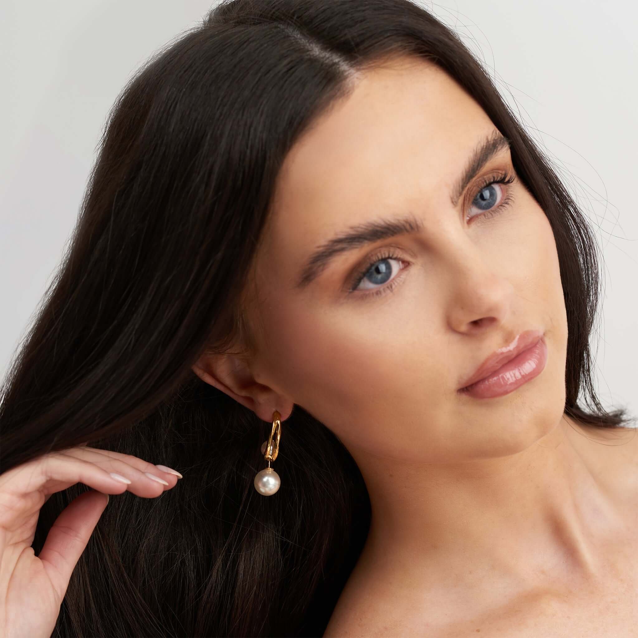 Aylah Pearl Drop Earring by ARIIRA, featuring a radiant pearl in a gold setting, elegant and timeless accessory.