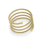 ARIIRA Zina Spiral Mesh Coil Bracelet in soft gold, featuring a textured finish and polished end spheres.