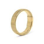 Yasira Ribbed Wide Gold Bangle Bracelet by ARIIRA, featuring a bold ribbed surface and smooth clasp closure.