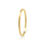 Sofia Diamante Gold Bangle by ARIIRA, a sleek gold-plated bangle with a dainty diamante for elegant everyday wear.