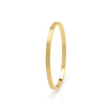 Sofia Diamante Gold Bangle by ARIIRA, a sleek gold-plated bangle with a dainty diamante for elegant everyday wear.