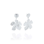 Malia Bloom Statement Earrings by ARIIRA, silver flower design with textured petals for elegant shimmer.