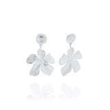 Malia Bloom Statement Earrings by ARIIRA, silver flower design with textured petals for elegant shimmer.