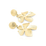 Malia Bloom Statement Earrings by ARIIRA, gold-plated floral design, textured petals reflecting light, lightweight and elegant.