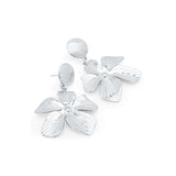 Malia Bloom statement earrings by ARIIRA, featuring silver petals with delicate textures for a bold yet lightweight look.